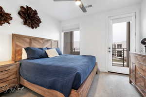 Carpeted bedroom featuring visible vents, ceiling fan, and baseboards