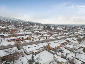 Snowy aerial view with a residential view