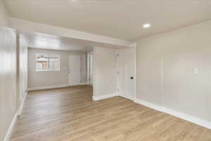 Empty room featuring light wood-type flooring and baseboards