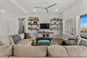 Living area featuring recessed lighting, ceiling fan, baseboards, and wood finished floors