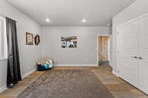 Playroom with baseboards and recessed lighting