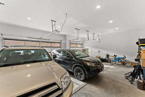 Garage with recessed lighting and a garage door opener