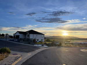 View of road featuring traffic signs, curbs, and a mountain view