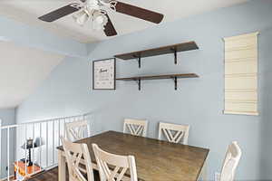 Dining room with ceiling fan and wood finished floors