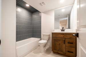 Bathroom featuring vanity, recessed lighting, and washtub / shower combination