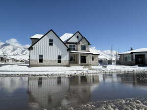 Exterior space with stone siding, board and batten siding, and a mountain view