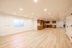 Unfurnished living room featuring recessed lighting and light wood-style floors