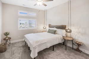 Bedroom featuring ceiling fan, carpet, visible vents, and baseboards