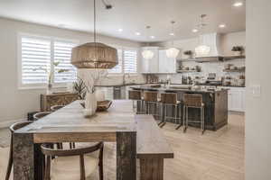 Dining space featuring recessed lighting, visible vents, light wood-style flooring, and baseboards