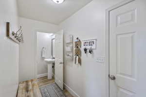 Bathroom featuring wood finished floors and baseboards