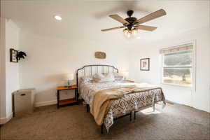 Bedroom with ceiling fan, recessed lighting, baseboards, ornamental molding, and carpet