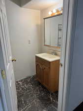 Bathroom with vanity and a textured ceiling