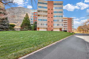 View of condo building / complex with a mountain view