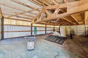 Garage featuring metal wall