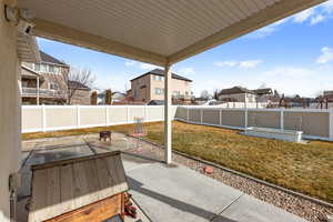 View of patio / terrace featuring a fenced backyard, a residential view, and a fire pit