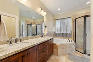 Full bath with tile patterned flooring, a sink, visible vents, and a shower stall