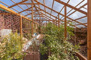 View of yard featuring a vegetable garden and an outdoor structure