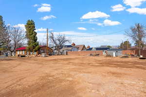 View of yard featuring a residential view and fence