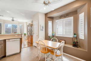 Dining space with ceiling fan, visible vents, and baseboards