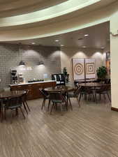 Dining space with brick wall and recessed lighting