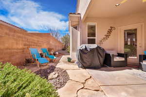 View of patio / terrace with a fenced backyard and a grill