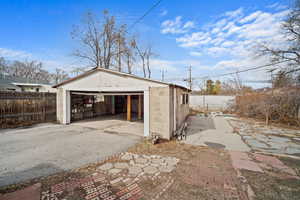 Detached garage featuring fence