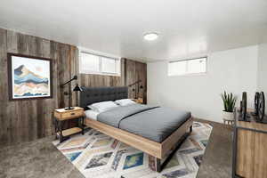 Carpeted bedroom featuring wooden walls