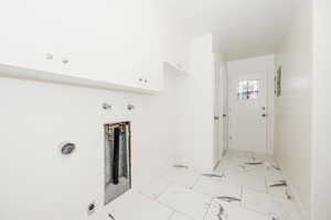 Clothes washing area with cabinets and hookup for an electric dryer