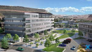 View of building exterior featuring uncovered parking and a mountain view