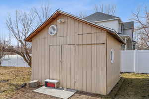 View of shed with fence