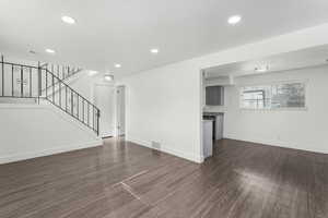 Recessed lighting, dark wood-type flooring