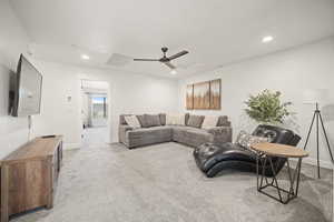 Living room featuring baseboards, carpet floors, visible vents, and recessed lighting