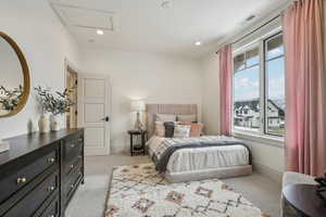 Bedroom with recessed lighting, attic access, visible vents, and light colored carpet