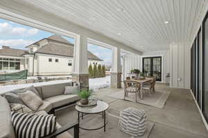 Sunroom with wood ceiling