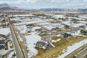 Snowy aerial view with a residential view and a mountain view