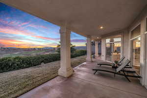 Patio terrace at dusk with a mountain view