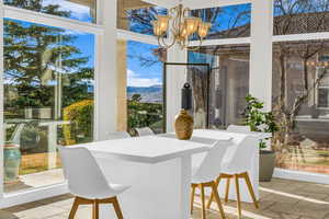 View of patio / terrace featuring a mountain view and outdoor dining space