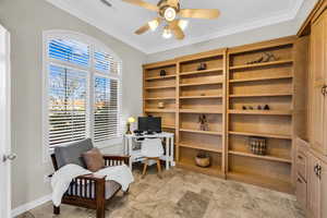 Office space with ornamental molding, visible vents, baseboards, and a ceiling fan