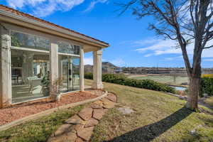 View of yard featuring a sunroom