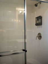 Full bathroom with a stall shower