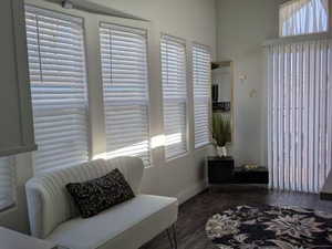 Sitting room featuring baseboards and wood finished floors