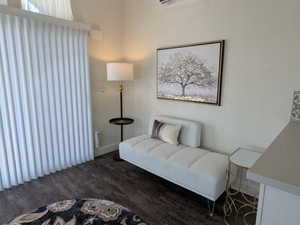 Sitting room featuring baseboards and wood finished floors