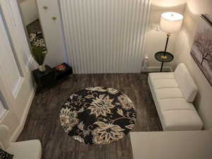 Living area featuring wood finished floors and baseboards