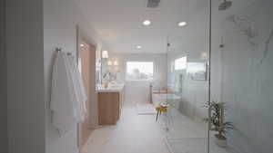 Full bath featuring recessed lighting, vanity, visible vents, a freestanding bath, and a shower