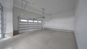 Garage featuring a garage door opener