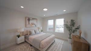 Bedroom featuring light carpet, visible vents, baseboards, and recessed lighting