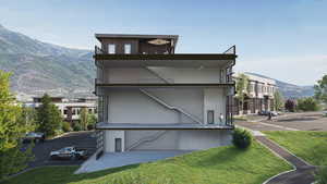 Exterior space featuring a mountain view and stucco siding