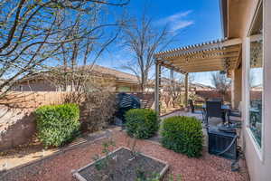 View of yard with a patio area, a fenced backyard, and a pergola