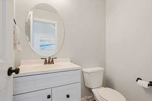 Bathroom featuring vanity and toilet