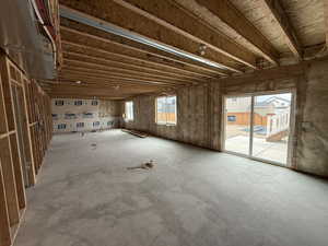 Miscellaneous room with unfinished concrete floors